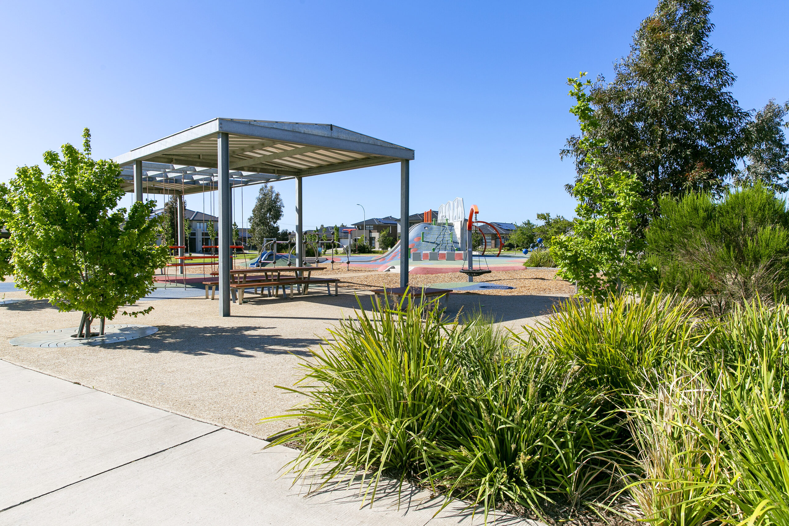 Family-friendly park with shaded picnic shelter, landscaped gardens and outdoor recreation areas in Tarneit